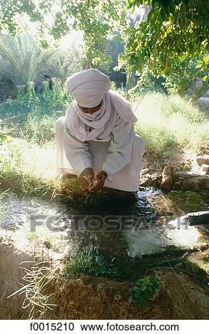Algeria, Tassili n'Ajjer, Djanet, Tuareg gardening View Large Photo Image Stock Image - Algeria, Tassili n'Ajjer, Djanet, Tuareg gardening. Fotosearch