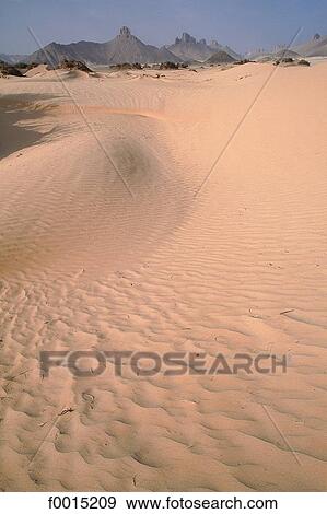 Algeria, Tassili n'Ajjer, sand dune and rocks View Large Photo Image Stock Photo - Algeria, Tassili n'Ajjer, sand dune and rocks. Fotosearch