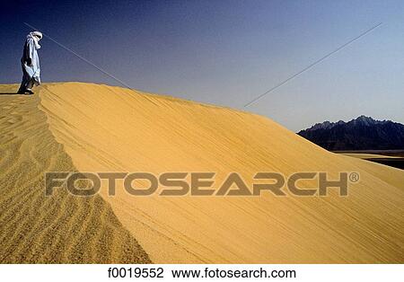 Algeria, Tassili n'Ajjer, sand dunes, Tuareg View Large Photo Image Stock Image - Algeria, Tassili n'Ajjer, sand dunes, Tuareg. Fotosearch