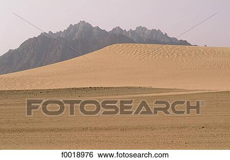 Stock Photograph - Algeria, Tassili n'Ajjer, sand dunes and rocks. Fotosearch
