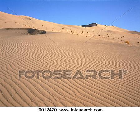 Stock Image - Algeria, Tassili n'Ajjer, sea of sand. Fotosearch