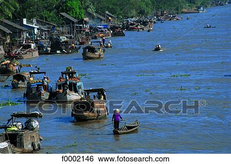 Stock Photograph - Vietnam, Can Tho, Mekong river delta, Phunghiep floating market. Fotosearch