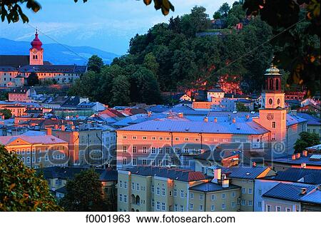 Stock Image - Austria, Salzburg, old city at sunset. Fotosearch