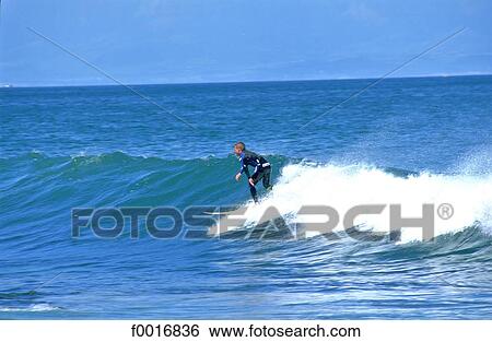 Stock Photograph - South Africa, Cape point, surfer. Fotosearch