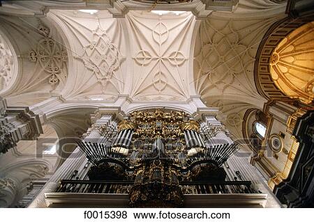 Stock Photo - Spain, Andalusia, Granada, cathedral, organ and sculpted vault. Fotosearch