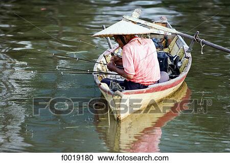 Stock Image - Malaysia, Borneo, Sarawak, Kuching, fishing on Sarawak river. Fotosearch