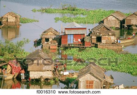 Stock Image - Cambodia, Siem Reap, pile village on lake Tonle Sap. Fotosearch