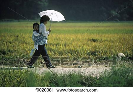 Stock Image - South Korea, Chungmu region, mother and child. Fotosearch