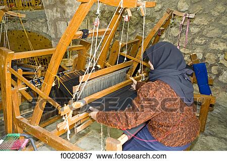 Jordan, Iraq al Amir, woman weaving cotton linen View Large Photo Image Stock Photo - Jordan, Iraq al Amir, woman weaving cotton linen. Fotosearch