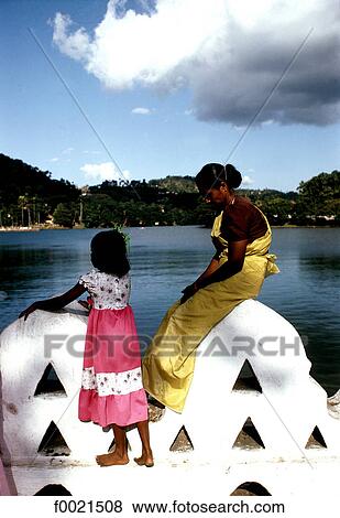 Sri Lanka, Kandy, Tooth Temple, mother and daughter View Large Photo Image Stock Photo - Sri Lanka, Kandy, Tooth Temple, mother and daughter. Fotosearch