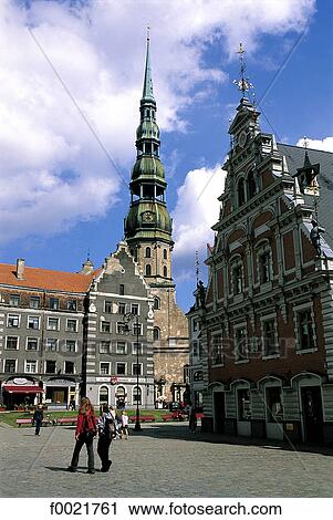Stock Image - Latvia, Riga, City Hall square with House of Blackheads and St Peter's church. Fotosearch