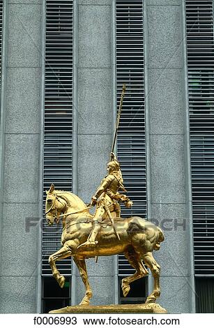 Stock Image - Louisiana, New Orleans, golden statue. Fotosearch
