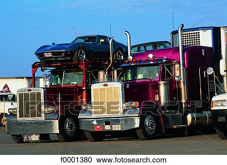 Stock Image - Wyoming, trucks in gas station. Fotosearch