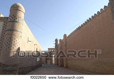 Stock Image - Uzbekistan, Khiva, lane and city walls. Fotosearch