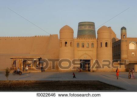 Uzbekistan, Khiva, Ota Darvoza (west gate) and Kalta Minor minaret View Large Photo Image Stock Photograph - Uzbekistan, Khiva, Ota Darvoza (west gate) and Kalta Minor minaret. Fotosearch