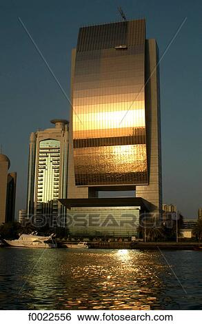 United Arab Emirates, Dubai, Creek Port, sunset reflected on the Bank of Dubai building View Large Photo Image Stock Photograph - United Arab Emirates, Dubai, Creek Port, sunset reflected on the Bank of Dubai building. Fotosearch