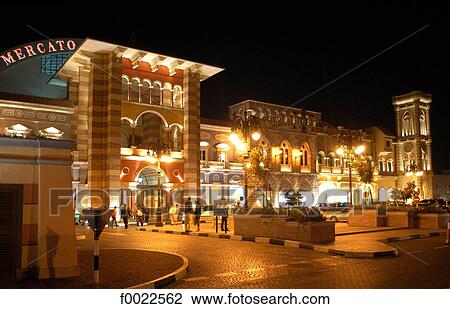Stock Image - United Arab Emirates, Dubai, shopping center by night. Fotosearch