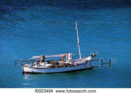 Picture - Spain, Balearic Islands, Ibiza, Cala Vedella, boat. Fotosearch