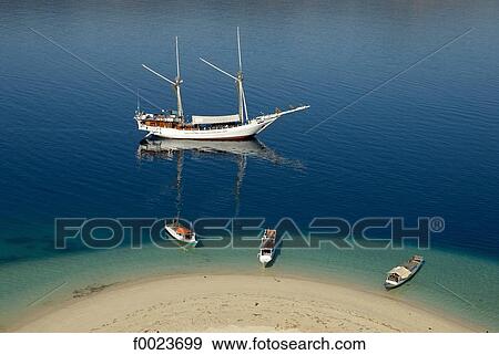 Indonesia, Flores, near Riung, Pulau Tujuhbelas archipelago, boats View Large Photo Image Stock Photo - Indonesia, Flores, near Riung, Pulau Tujuhbelas archipelago, boats. Fotosearch