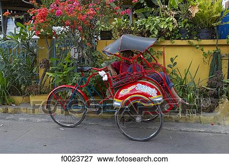 Indonesia, Java, Yogyakarta, Kraton district, rickshaw View Large Photo Image Stock Photo - Indonesia, Java, Yogyakarta, Kraton district, rickshaw. Fotosearch