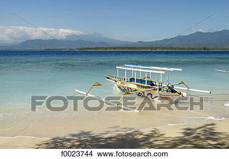 Indonesia, Lombok, Gili Islands, Gili Air, outrigger View Large Photo Image Picture - Indonesia, Lombok, Gili Islands, Gili Air, outrigger. Fotosearch