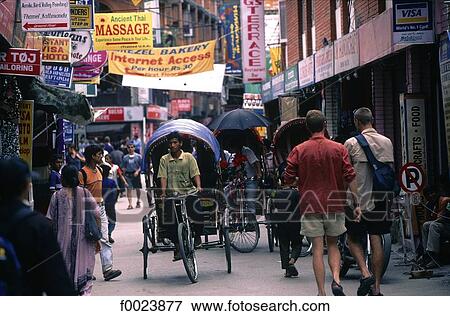 Stock Photo - Nepal, Kathmandu, Thamel, rickshaws in lane. Fotosearch
