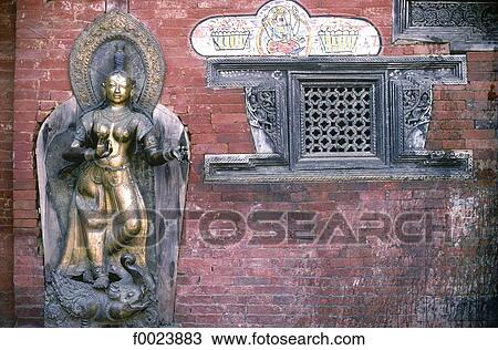 Stock Image - Nepal, Patan, Royal Palace, Mul Chowk, facade and statue of goddess Ganga. Fotosearch
