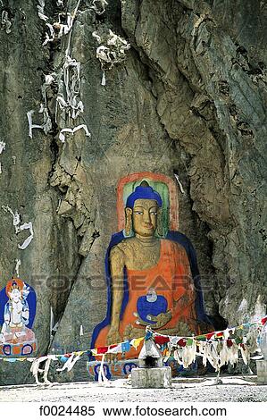 Stock Photography - China, Tibet, near Drolma Lhakhang Monastery, Buddha painted on a rock. Fotosearch