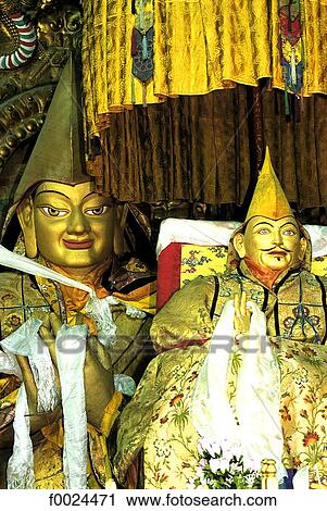 Stock Image - China, Tibet, near Lhasa, Drepung Monastery, statues of the 13th Dalai Lama and Tsongkhapa. Fotosearch