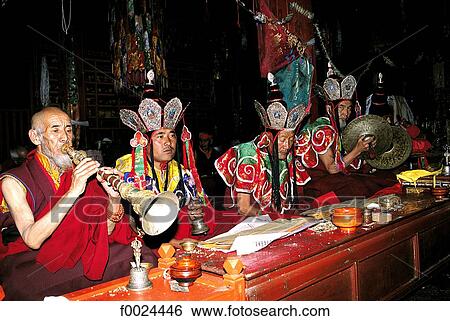Stock Photograph - China, Tibet, Tandruk Monastery, monks at prayer. Fotosearch