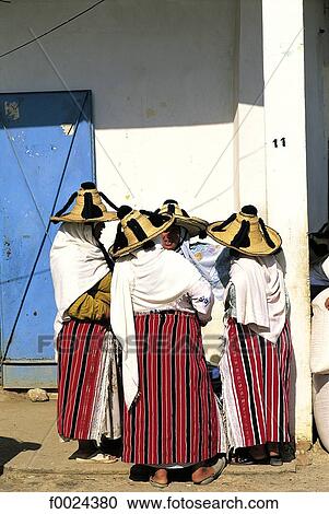 Stock Image - Morocco, Khemis Anjra, souk, Jebala women wearing traditional costume. Fotosearch
