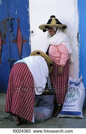 Stock Image - Morocco, Khemis Anjra, souk, Jebala women wearing traditional costume. Fotosearch