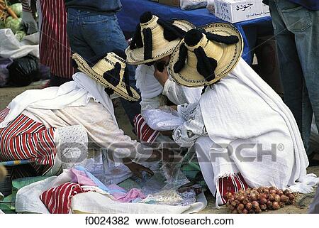 Stock Image - Morocco, Ksar-es-Sghir, souk, Jebala women wearing traditional costume. Fotosearch