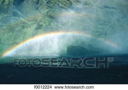 Iceland, Skogar, rainbow near Skogafoss waterfall View Large Photo Image Picture - Iceland, Skogar, rainbow near Skogafoss waterfall. Fotosearch