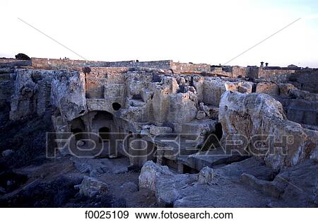 Stock Photo - Cyprus, Paphos, Tombs of the Kings at dusk. Fotosearch