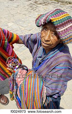 Guatemala, Panajachel, market, Indian woman selling multicoloured fabrics View Large Photo Image Stock Image - Guatemala, Panajachel, market, Indian woman selling multicoloured fabrics. Fotosearch