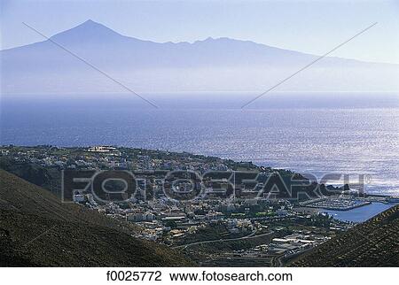 Stock Image - Spain, Canary Islands, La Gomera, San Sebastian de la Gomera and Tenerife in the distance. Fotosearch
