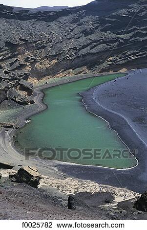 Stock Image - Spain, Canary Islands, Lanzarote, El Golfo crater, the green lagoon. Fotosearch