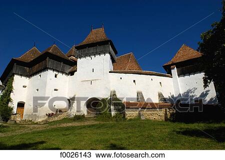 Stock Image - Romania, Transylvania, Viscri, Saxon citadel. Fotosearch
