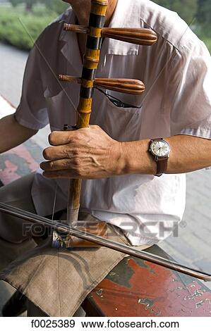 Stock Photo - China, Beijing, erhu player. Fotosearch