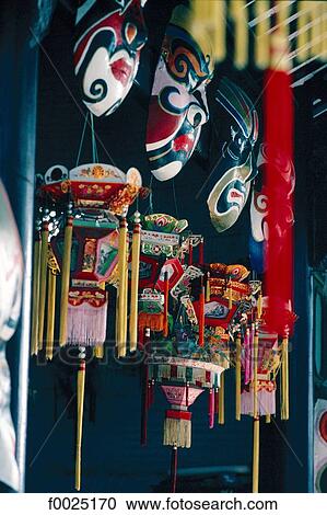 Stock Image - China, Hong Kong, traditional lanterns and opera masks. Fotosearch