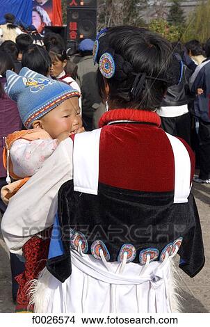 Picture - China, Yunnan, Lijiang, Naxi mother and child. Fotosearch