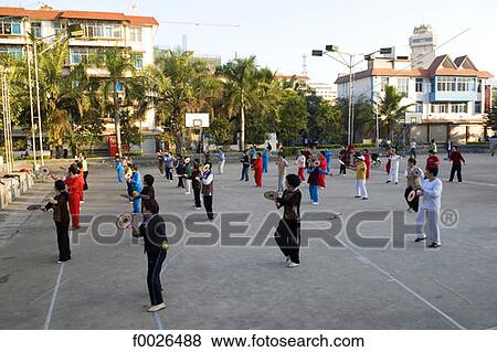 China, Yunnan, Xishuangbanna, Jinghong, tennis lesson View Large Photo Image Stock Photo - China, Yunnan, Xishuangbanna, Jinghong, tennis lesson. Fotosearch