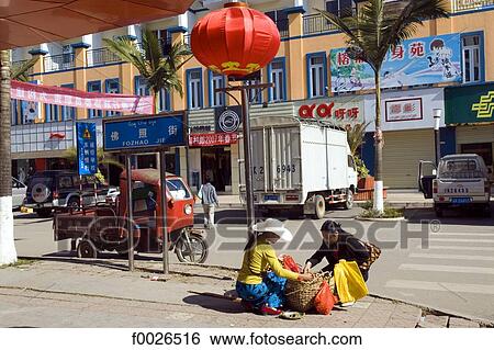 China, Yunnan, Xishuangbanna, Menghai, street scene View Large Photo Image Stock Photograph - China, Yunnan, Xishuangbanna, Menghai, street scene. Fotosearch