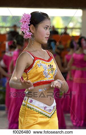 China, Yunnan, Xishuangbanna, near Jinghong, Dai Minority Park, young Dai dancer View Large Photo Image Stock Image - China, Yunnan, Xishuangbanna, near Jinghong, Dai Minority Park, young Dai dancer. Fotosearch