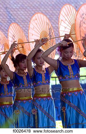 China, Yunnan, Xishuangbanna, near Jinghong, Dai Minority Park, young Dai dancers View Large Photo Image Stock Photo - China, Yunnan, Xishuangbanna, near Jinghong, Dai Minority Park, young Dai dancers. Fotosearch