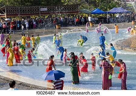 China, Yunnan, Xishuangbanna, near Jinghong, Dai Minority Park, during Water Splashing Festival View Large Photo Image Stock Photo - China, Yunnan, Xishuangbanna, near Jinghong, Dai Minority Park, during Water Splashing Festival. Fotosearch
