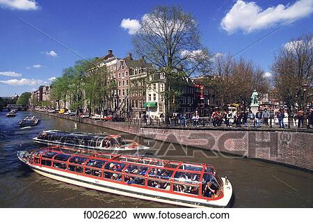 The Netherlands, North Holland, Amsterdam, bateau mouche on canal View Large Photo Image Stock Image - The Netherlands, North Holland, Amsterdam, bateau mouche on canal. Fotosearch