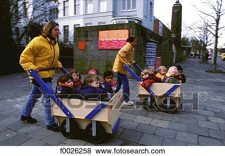 Stock Photo - The Netherlands, South Holland, Rotterdam, go for a cart ride. Fotosearch