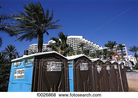 Stock Photo - Israel, Eilat, toilet cubicles on the beach. Fotosearch
